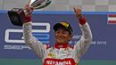 Ekspresi bahagia Rio Haryanto menjadi juara di race 2 GP2 Austria. (Bola.com/Reza Khomaini)