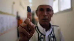 Pasca jatuhnya rezim Muamar Gaddafi tiga tahun lalu, Warga Libya melakukan Pemilu untuk memilih anggota parlemen yang baru, (25/6/2014). (REUTERS/Esam Omran Al-Fetori)