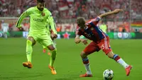 IMPIKAN - Bek Barcelona, Gerard Pique mengimpikan bisa menghadapi Real Madrid di final Liga Champions (AP Photo/Kerstin Joensson)