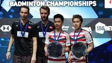 Ganda putra Indonesia, Kevin Sanjaya dan Marcus Gideon meraih gelar All England di Birmingham, Minggu (18/3/2018). Mereka juara setelah mengalahkan Mathias Boe dan Carsten Mogensen dengan skor 21-18, 21-17. (AFP/Paul Ellis)