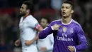 Bintang Real Madrid, Cristiano Ronaldo, merayakan gol yang dicetaknya ke gawang Sevilla melalui titik penalti. Los Blancos semapt unggul 1-0 melalui penalti Ronaldo yang terjadi pada menit ke-67. (AFP/Jorge Guerrero)