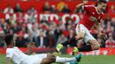 Pemain MU, Ander Herrera (kanan), dijatuhkan pemain Liverpool, Joe Gomez, di Stadion Old Trafford, Inggris. Sabtu (12/9/2015). (EPA/Lindsey Parnaby)