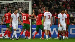 Tampil percaya diri, timnas Portugal sukses melanjutkan tren positif mereka di ajang UEFA Nations League 2024 dan unggul dengan skor 3-1 atas Polandia. (Sergei GAPON/AFP)