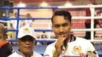 Personel Polres Pemalang, Briptu Faza Iza Syuhada menyabet medali perunggu dalam cabor tinju Porprov Jateng 2023. (Foto: Liputan6.com/Polres Pemalang)