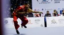 Atlet Wushu beraksi pada Kejuaraan Nasional Wushu di Sport Mall Britama Arena Kelapa Gading,Jakarta, Sabtu, (28/10/2017). Ajang tersebut juga sebagai test event Asian Games XVIII 2018. (Bola.com/M Iqbal Ichsan)
