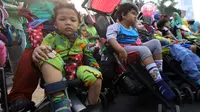 Sejumlah anak penyandang Cerebral Palsy mengikuti kampanye untuk memperingati Hari Cerebral Palsy Sedunia di kawasan Car Free Day, Jakarta, Minggu (13/10/2019). Kegiatan tersebut dilakukan untuk memperingati Hari Cerebral Palsy Sedunia yang jatuh pada tanggal 6 Oktober. (Liputan6.com/Johan Tallo)