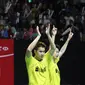 Kevin Sanjaya Sukamuljo/Marcus Fernaldi mengekspresikan kegembiraan seusai mengalahkan ganda Cina Li Junhui/Liu Yuchen dI babak final Indonesia Masters 2018, Jakarta, Minggu (28/1). Kevin/Marcus menang 11-21, 21-10, dan 21-16. (Liputan6.com/Angga Yuniar)