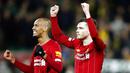 Para pemain Liverpool, Andrew Robertson dan Fabinho, merayakan kemenangan atas Norwich City pada laga Premier League di Stadion Carrow Road Minggu (16/2/2020). Liverpool menang 1-0 atas Norwich City. (AP/Frank Augstein)