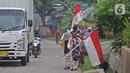 HARI SANTRI NASIONAL: Sejumlah anak pengajian melakukan pawai di Jalan Raya Tapos, Depok, Jawa Barat, Kamis (22/10/2020). Pengajian Kampung Tapos menggelar pawai menyambut Hari Santri Nasional 2020 yang diperingati setiap tanggal 22 Oktober. (Liputan6.com/Herman Zakharia)