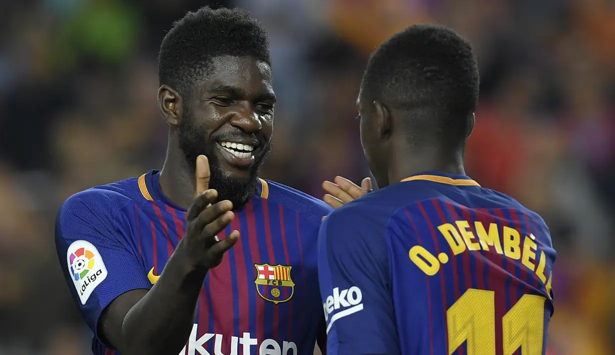5. Samuel Umtiti (Prancis) - Sebesar 500 juta euro dengan kontrak hingga 30 Juni 2023. (Photo by LLUIS GENE / AFP)