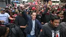 Selain di Caracas, aksi protes juga terjadi di berbagai kota dunia seperti New York, Madrid, Ankara, dan Istanbul untuk mengecam tindakan AS tersebut. Tampak dalam foto, pendukung mantan Presiden Venezuela, Nicolas Maduro, saat menggelar aksi unjuk rasa di Caracas pada Minggu 4 Januari 2026. (Juan BARRETO/AFP)