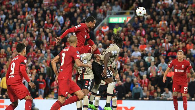 Joel Matip saat mencetak gol kemenangan Liverpool atas Ajax di Liga Champions