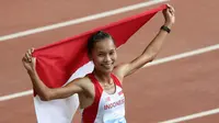 EMAS - Rini Budiarti menyumbangkan medali emas untuk Indonesia dari cabang atletik. (Bola.com/Arief Bagus)