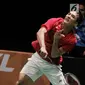 Pebulu tangkis Indonesia Christie Jonatan memukul kok saat melawan Malaysia dalam laga perempat final Sea Games 2017 di Axiata Arena, Kuala Lumpur, Malaysia, Rabu (27/8). Indonesia menang dengan skor 21-13. (Liputan6.com/Faizal Fanani)