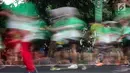 Sejumlah peserta mengikuti Lomba lari MILO Jakarta International 10K 2017 di Jakarta, Minggu (23/7). MILO Jakarta International 10K 2017 melombakan tiga kategori yakni 10K, 5K dan Family Run 1,7K. (Liputan6.com/Faizal Fanani)