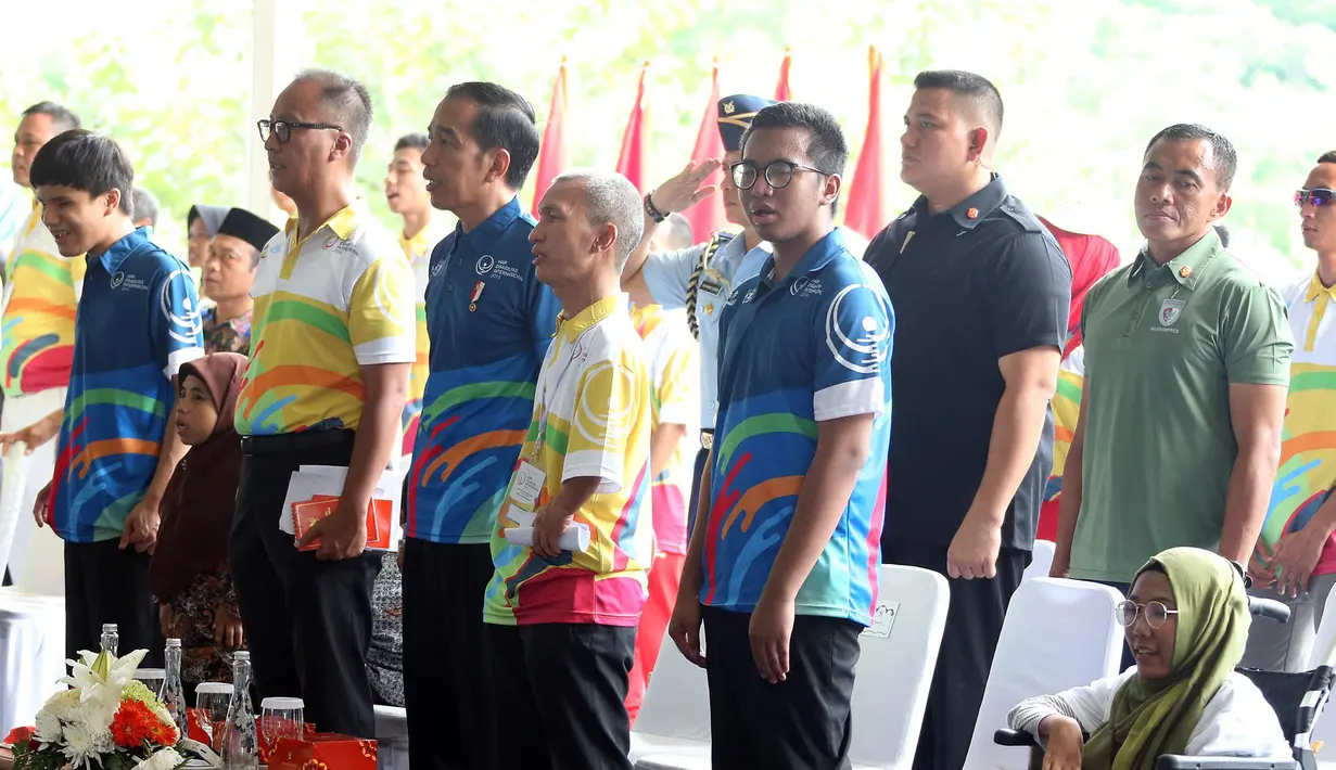 Presiden Joko Widodo atau Jokowi saat menghadiri peringatan Hari Disabilitas Internasional 2018 di Bekasi, Jawa Barat, Senin (3/12). Menurut Jokowi, pembangunan pabrik untuk penyandang disabilitas sangat penting. (Liputan6 com/Angga Yuniar)