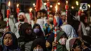Warga mengikuti pawai obor menyambut Ramadan di kawasan Matraman Dalam, Jakarta, Minggu (27/3/2022). Pawai obor tersebut juga digelar untuk meningkatkan silaturahmi dan ukhuwah sesama umat Muslim serta menyemarakkan syiar Islam di Ibu Kota. (Liputan6.com/Faizal Fanani)