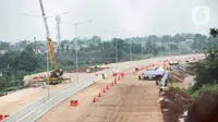 Pemandangan proyek pembangunan Jalan Tol Lingkar Luar Jakarta (JORR) II ruas Cinere-Serpong di kawasan Pondok Cabe, Tangerang Selatan, Banten, Jumat (13/12/2019). Saat ini, lahan yang sudah dibebaskan dalam proyek tersebut sebanyak 83 persen. (Liputan6.com/Faizal Fanani)