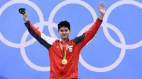 Josep Schooling menjadi peraih medali emas pertama Singapura sepanjang sejarah Olimpiade. (AFP/Gabriel Bouys)