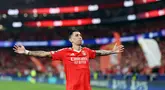 Angel Di Maria dari Benfica melakukan selebrasi usai mencetak gol ke gawang Atletico Madrid pada laga leg kedua Liga Champions di Estadio do Benfica, Kamis (3/10/2024). (AFP/Filipe Amorim)