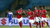 Evan Dimas dkk. merayakan gol ke gawang Laos pada penyisihan Grup A Piala AFF 2014. (AFP/STR)