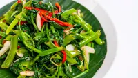 Ilustrasi tumis kangkung/Shutterstock-Yang Umar.