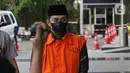 Bupati (nonaktif) Penajam Paser Utara (PPU) Abdul Gafur Mas'ud bersiap menjalani sidang lanjutan yang digelar secara daring di Gedung Merah Putih KPK, Jakarta, Kamis (4/8/2022). Sebelumnya, JPU KPK mendakwa Abdul Gafur Mas'ud menerima suap Rp 5,7 miliar terkait proyek dan perizinan di Pemerintah Kabupaten PPU. (Liputan6.com/Helmi Fithriansyah)