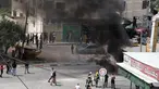 Asap mengepul selama bentrokan antara warga Palestina dan pasukan Israel di kota Jenin di Tepi Barat pada 13 Mei 2022. Israel memperkuat pasukan keamanan di Yerusalem menjelang pemakaman veteran jurnalis Al Jazeera Shireen Abu Akleh, dua hari setelah dia terbunuh dalam serangan tentara Israel. (AFP/JAAFAR ASHTIYEH)