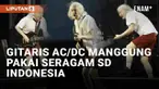 Konser AC/DC di Zurich, Swiss viral di media sosial. Warganet Indonesia menyoroti aksi nyeleneh sang gitaris, Angus Young. Alih-alih konser dengan kostum sangar khas genre hard rock yang mereka bawa. Angus malah memakai kostum ala seragam SD Indonesi...