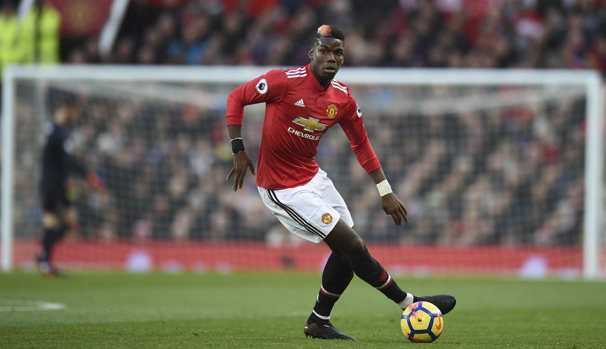 Gelandang Manchester United, Paul Pogba mencattkan namanya pada daftar pemberi assist terbanyak Premier League, Pogba total mengantongi lima assist hingga pekan ke-16. (AFP/Oli Scarff)