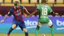 Pada menit ke-10, tembakan Lionel Messi bersarang di pojok gawang Al Ahli. Ini adalah gol kedua Barcelona. (AFP/Karim Jaafar)
