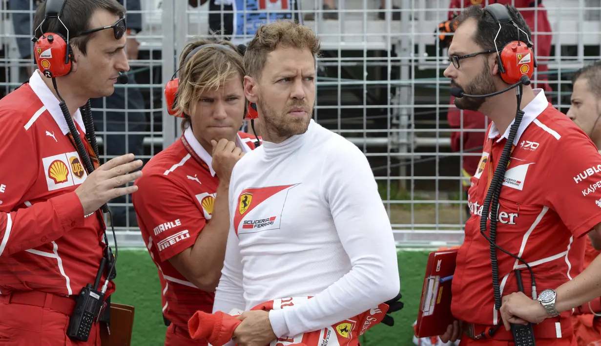 Pebalap Ferrari, Sebastian Vettel saat ini masih memimpin puncak klasemen semetara F1 2017 dengan jumlah poin sebanyak 153. (Paul Chiasson/The Canadian Press via AP)