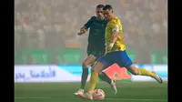 Pemain Al-Nassr, Cristiano Ronaldo mencetak gol pertama timnya ke gawang Al-Ahli pada laga Liga Arab Saudi yang berlangsung di King Saud University Stadium, Riyadh, Arab Saudi, Sabtu (23/09/2023) dini hari WIB. Ronaldo berhasil melesatkan gol pembuka pada menit keempat. (Twitter/@AlNassrFC)