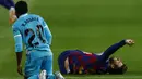Pemain Barcelona Gerard Pique meringis kesakitan saat bertanding melawan Leganes pada pertandingan La Liga Spanyol di Camp Nou, Barcelona, Spanyol, Selasa (16/6/2020). Barcelona menang 2-0 lewat gol Ansu Fati dan Lionel Messi. (AP Photo/Joan Montfort)