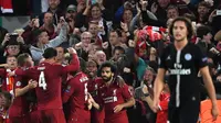 Para pemain Liverpool merayakan gol yang dicetak James Milner ke gawang PSG pada laga Liga Champions di Stadion Anfield, Liverpool, Selasa (18/9/2018). Liverpool menang 3-2 atas PSG. (AP/Paul Ellis)