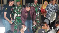 Kapolres Grobogan, AKBP Anung Dedy Kurniawan meminta keterangan mereka yang ditangkap karena judi. Foto: liputan6.com/Felek wahyu&nbsp;