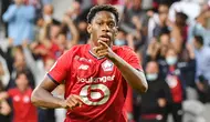 Jonathan David - Pemain timnas Kanada tampil tajam untuk Lille musim ini. Dia berhasil mencetak 16 gol dari 34 pertandingan di semua kompetisi. Bomber yang kini memasuki usia 22 tahun cocok untuk investasi jangka panjang Manchester United. (AFP/Denis Charlet)