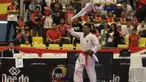 Ahmad Zigi Zaresta merayakan keberhasilannya meraih emas pada Kejuaraan Dunia Karate Junior, Cadet dan U-21 di ICE, BSD, Tangerang, Kamis (12/11/2015). (Bola.com/Vitalis Yogi Trisna)