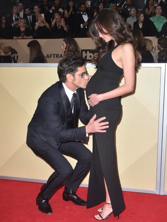 Dua bulan kemudian, aktor Full House tersebut mengonfirmasi bahwa mereka tengah menantikan buah hati pertama. (FREDERIC J. BROWN / AFP)