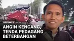 Diterjang angin kencang, tenda bazar makanan untuk berbuka puasa porak-poranda. Seorang pengendara motor yang melintas sempat tertimpa tenda yang roboh.
