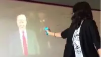 Seorang guru sekolah menengah diskors setelah video dirinya menembak Donald Trump dengan pistol air tersebar.