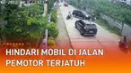Rekaman CCTV memperlihatkan seorang pemotor terjatuh saat menghindari mobil di jalan mengundang perhatian.