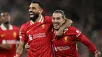 Pemain Liverpool Mohamed Salah (kiri) bersama Kostas Tsimikas merayakan gol pada laga matchday 2 League Phase Liga Champions 2024/2025 melawan Bologna di Anfield Stadium, Inggris pada Rabu 2 Oktober 2024 atau Kamis (3/10/2024) dini hari WIB. (Paul ELLIS/AFP)