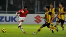 Muhammad Ridwan. Pemain sayap yang pensiun dari Timnas Indonesia di 2014 ini mampu mencetak 2 gol saat melawan Malaysia di Piala AFF 2010. Satu gol dicetak di penyisihan grup (1/12/2010), skor akhir 5-1 dan 1 gol lagi di final leg kedua (29/12/2010), skor akhir 2-1 untuk Indonesia. (AFP/Adek Berry)