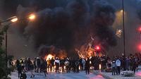 Kerusuhan di Malmo, Swedia pada 28 Agustus 2020. Ricuh pecah terkait dengan perkumpulan massa pembakar al-Quran dan kedatangan politikus anti-Muslim asal Denmar yang hendak berpartisipasi. (AFP)