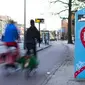 Pesepeda melewati Flo, alat yang membantu pengendara agar dapat mengejar lampu hijau dengan baik di Utrecht, Belanda (Springlab)