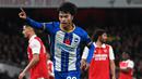 Selebrasi gelandang Brighton and Hove Albion, Kaoru Mitoma setelah menjebol gawang Arsenal pada laga putaran ketiga Piala Liga Inggris 2022/2023 di Emirates Stadium, London (9/11/2022). Brighton memulangkan Kaoru Mitoma pada awal musim 2022/2023 setelah tampil impresif bersama Union Saint-Galloise selama masa peminjaman dengan mencetak 8 gol dan 4 assist dari 29 laga. (AFP/Glyn Kirk)