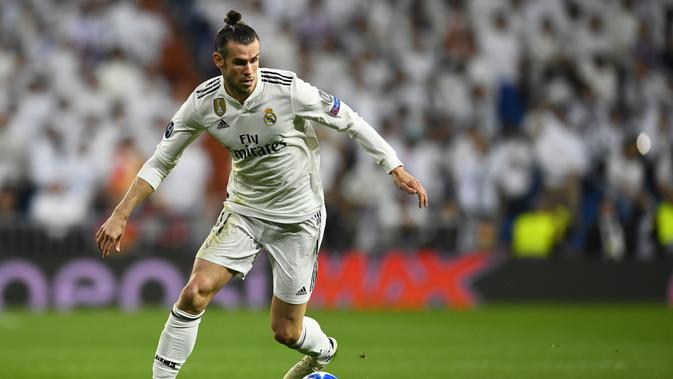 1. Gareth Bale - Sepeninggal Ronaldo, otomatis Real Madrid bergantung kepada Bale di sektor lini depan. Terbukti 11 laga sudah dilakoni pemain timnas Wales tersebut. (AFP/Joe Klamar)