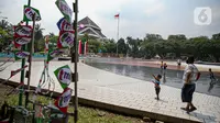 Wisatawan saat mengunjungi TMII, Jakarta, Kamis (20/8/2020). Libur panjang yang bertepatan tahun baru islam di manfaatkan masyarakat bersama keluarga  berlibur ke sejumlah tempat wisata. (Liputan6.com/Faizal Fanani)