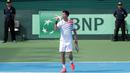 Ekspresi David Agung Susanto saat mengalahkan petenis Filipina, Jeson Patrombon pada Piala Davis 2018 grup dua Asia/Oceania di Senayan, Jakarta, Sabtu (3/2/2018). David menang 6-2, 7-5. (Bola.com/Nick Hanoatubun)